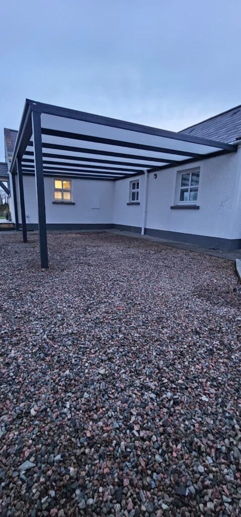 Carport over a gravel drive